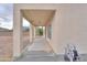 Spacious covered patio with concrete flooring offers outdoor living space and backyard access at 2194 N Magdelena Pl, Casa Grande, AZ 85122