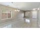 Bright dining room with tiled floor, chandelier, and windows at 2194 N Magdelena Pl, Casa Grande, AZ 85122