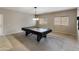 Cozy game room with a black pool table, neutral colors, and plenty of natural light at 2194 N Magdelena Pl, Casa Grande, AZ 85122