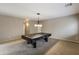 Inviting game room featuring a billiard table with modern lighting and neutral decor at 2194 N Magdelena Pl, Casa Grande, AZ 85122