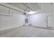 Spacious garage with ample storage, water heater, and an overhead rack perfect for tools and equipment at 2194 N Magdelena Pl, Casa Grande, AZ 85122