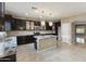 Modern kitchen featuring granite countertops, stainless steel appliances, and elegant lighting at 2194 N Magdelena Pl, Casa Grande, AZ 85122