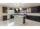 Beautiful kitchen boasts stainless appliances, granite countertops, and a center island at 2194 N Magdelena Pl, Casa Grande, AZ 85122