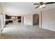 Open floor plan with view of kitchen and carpeted living area at 2194 N Magdelena Pl, Casa Grande, AZ 85122