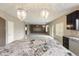 Open floor plan features granite counters and a clear view of the living room at 2194 N Magdelena Pl, Casa Grande, AZ 85122