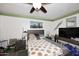 Bedroom featuring tiled floors, ceiling fan and a TV at 2916 N 48Th Ave, Phoenix, AZ 85031