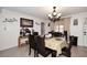 Inviting dining room with a chandelier and seating for six, perfect for Gathering dinners at 2916 N 48Th Ave, Phoenix, AZ 85031