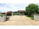 Charming single-story home with well-kept lawn and a long driveway, with a gate to the side at 2916 N 48Th Ave, Phoenix, AZ 85031