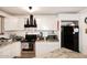A close up of the kitchen with stainless steel appliances and white cabinets at 2916 N 48Th Ave, Phoenix, AZ 85031