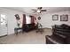 Cozy living room with tile flooring, ceiling fan, and plush furniture for comfortable living at 2916 N 48Th Ave, Phoenix, AZ 85031