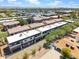 The aerial shot captures modern condos in a vibrant urban setting with mountain views at 3010 N 37Th St # 6, Phoenix, AZ 85018