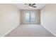 Neutral bedroom with ceiling fan and doors leading to the outside at 3010 N 37Th St # 6, Phoenix, AZ 85018