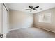 Bedroom with a ceiling fan, closet, and window at 3010 N 37Th St # 6, Phoenix, AZ 85018