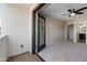 Bedroom features include ceiling fan, carpet, and doors to the outside at 3010 N 37Th St # 6, Phoenix, AZ 85018
