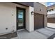 Modern condo with a glass front door and a garage, perfect for contemporary living at 3010 N 37Th St # 6, Phoenix, AZ 85018