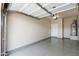 This garage is well-lit with epoxy floors and ample storage space at 3010 N 37Th St # 6, Phoenix, AZ 85018