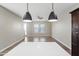 Bright, open-concept kitchen featuring a central island and great lighting with view into an adjacent room at 3010 N 37Th St # 6, Phoenix, AZ 85018