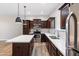 Modern kitchen featuring stainless steel appliances, a kitchen island, and granite countertops for an elegant touch at 3010 N 37Th St # 6, Phoenix, AZ 85018