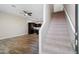 View of the living room with wood floors, fan, and stairs leading up to the next level at 3010 N 37Th St # 6, Phoenix, AZ 85018