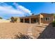 Large backyard with a stone pathway and covered patio at 3034 E Turney Ave, Phoenix, AZ 85016