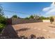 Large gravel backyard with block fence, providing a low-maintenance outdoor space with privacy at 3034 E Turney Ave, Phoenix, AZ 85016