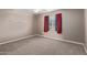 Carpeted bedroom with window and neutral walls, perfect for relaxation at 3034 E Turney Ave, Phoenix, AZ 85016
