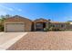 Charming home featuring a low-maintenance desert landscape, covered entryway, and an attached two-car garage at 3034 E Turney Ave, Phoenix, AZ 85016