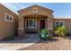 Inviting front porch with stone pillars, decorative plants, and an ADT security sign for added peace of mind at 3034 E Turney Ave, Phoenix, AZ 85016