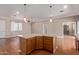 Large kitchen island provides extra counter space and seating, enhancing this open-concept kitchen at 3034 E Turney Ave, Phoenix, AZ 85016