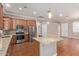Updated kitchen with granite countertops, stainless steel appliances, and an eat-in kitchen island at 3034 E Turney Ave, Phoenix, AZ 85016