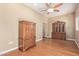 Hardwood floor living room features built in wood cabinets and ample storage space at 3034 E Turney Ave, Phoenix, AZ 85016