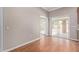 Bright living room with hardwood floors and sliding glass doors leading to the outdoor patio area at 3034 E Turney Ave, Phoenix, AZ 85016