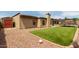 Spacious backyard featuring low maintenance landscaping, gravel and artificial turf at 317 E Harwell Rd, Gilbert, AZ 85234