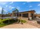 The backyard features pavers, artificial grass, trampoline, and other outdoor items at 317 E Harwell Rd, Gilbert, AZ 85234