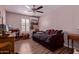 Cozy bedroom with a daybed, wood-look tile flooring, and stylish shelving at 317 E Harwell Rd, Gilbert, AZ 85234
