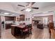 Eat-in kitchen open to a Gathering room featuring a fireplace and wood-look tile floors at 317 E Harwell Rd, Gilbert, AZ 85234