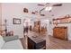 Open-concept living area featuring vaulted ceilings and wood-look tile flooring at 317 E Harwell Rd, Gilbert, AZ 85234