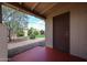 Backyard patio with a dark brown door that leads to a beautiful backyard at 322 N Williams St, Mesa, AZ 85203