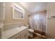 Bathroom with a single sink vanity, neutral walls, and a patterned shower curtain at 322 N Williams St, Mesa, AZ 85203