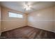 Neutral bedroom with carpet floors, a ceiling fan, and a sunny window at 322 N Williams St, Mesa, AZ 85203