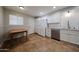 Updated kitchen with granite countertops, stainless steel dishwasher, and tiled floors at 322 N Williams St, Mesa, AZ 85203
