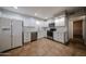 Kitchen showcasing updated appliances, white cabinets, and modern countertops at 322 N Williams St, Mesa, AZ 85203