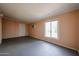 The living room has peach walls and a window at 322 N Williams St, Mesa, AZ 85203