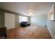 Bright living room featuring large windows, tile flooring, and a ceiling fan at 322 N Williams St, Mesa, AZ 85203