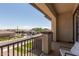 Inviting covered balcony with views of the neighborhood showcasing manicured lawns and desert landscaping at 3408 E Daley Ln, Phoenix, AZ 85050
