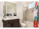 Well-lit bathroom featuring tiled shower/tub combo, modern vanity, stylish faucet, and coordinated decor at 3408 E Daley Ln, Phoenix, AZ 85050