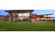 Exterior features a large green lawn, patio seating, and multiple covered structures at 3408 E Daley Ln, Phoenix, AZ 85050