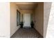 Inviting front entryway with potted plants and a decorative welcome mat, leading into the home at 3408 E Daley Ln, Phoenix, AZ 85050