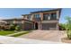 Stunning exterior view of a two-story house showcasing brick accents and a lovely front yard at 3408 E Daley Ln, Phoenix, AZ 85050