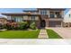 Beautiful two-story home with a well-manicured lawn, brick accents, and inviting entryway at 3408 E Daley Ln, Phoenix, AZ 85050